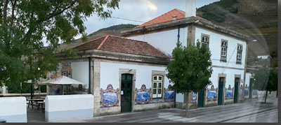 A white building with a red roof